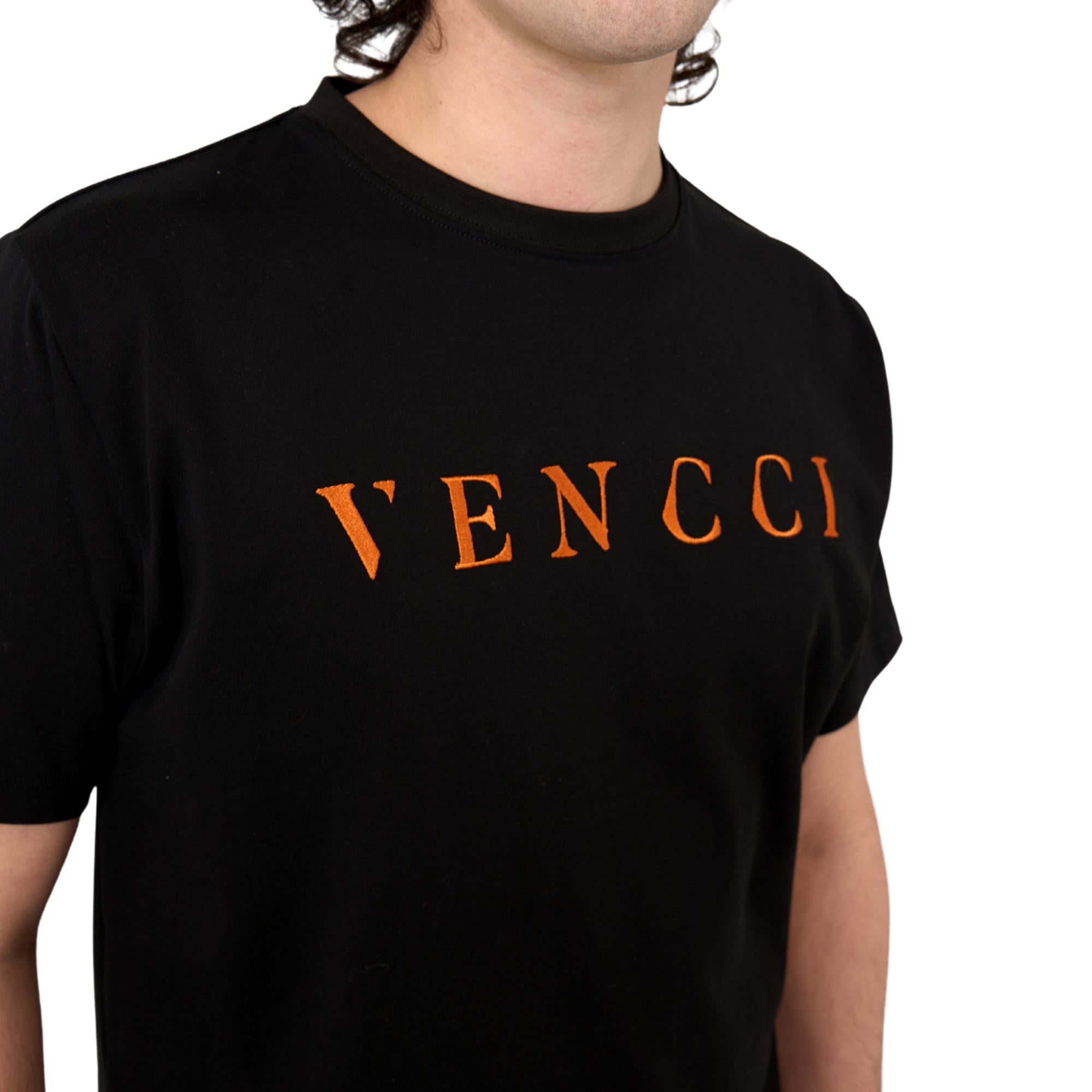 Vivid Orange black tee — back view